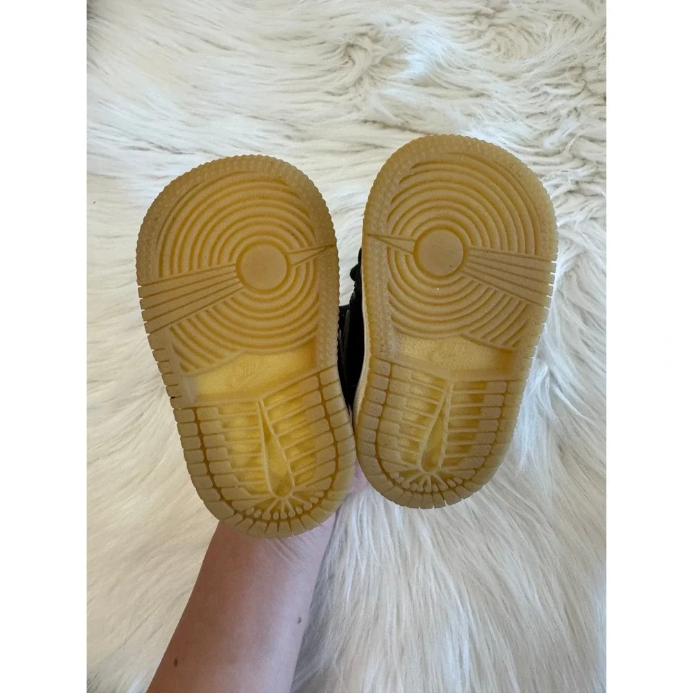 Nike black and gold size 2C